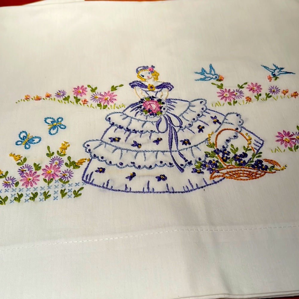 Vintage pair of standard size pillowcases with beautiful embroidery of girl